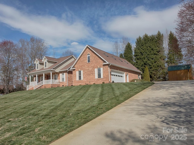 view of front of house featuring covered porch, brick siding, a front lawn, and an attached garage