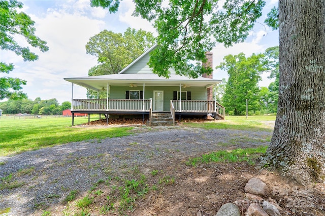3640 Oak Haven Ln, Shelby, NC 28150 - farmhouse-style home with a porch, a chimney, a front yard, and ceiling fan