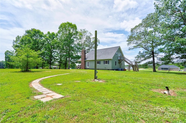 3640 Oak Haven Ln, Shelby, NC 28150 - view of green lawn featuring stairway and central AC unit