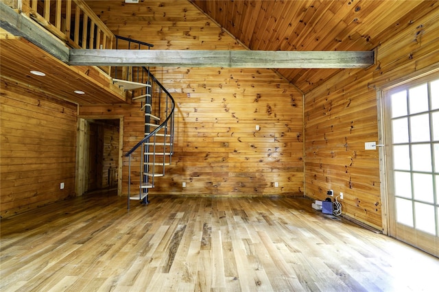 3640 Oak Haven Ln, Shelby, NC 28150 - unfurnished living room featuring wood walls, healthy amount of natural light, stairway, and wood finished floors