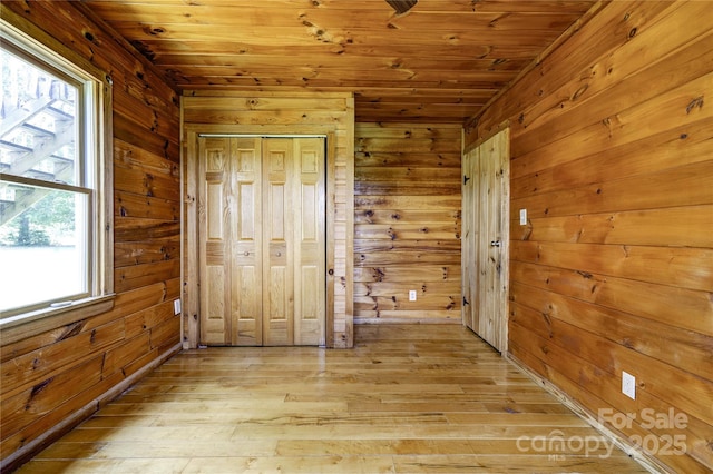 3640 Oak Haven Ln, Shelby, NC 28150 - unfurnished bedroom with wood walls, wooden ceiling, and light wood-style floors