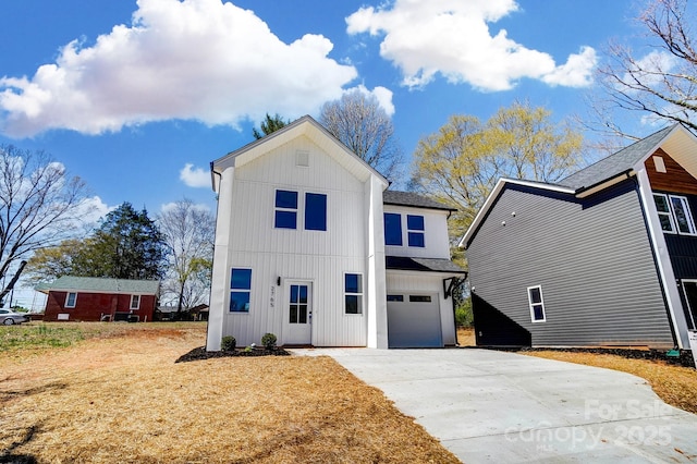 modern farmhouse style home featuring an attached garage and concrete driveway