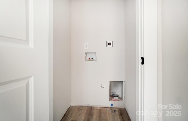 clothes washing area with wood finished floors, laundry area, hookup for an electric dryer, and hookup for a washing machine