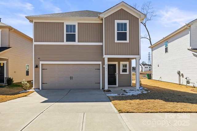 view of front of home featuring driveway, board and batten siding, and an attached garage