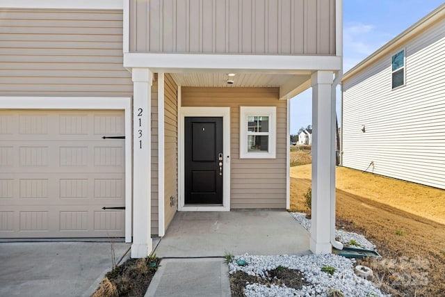 entrance to property featuring a garage