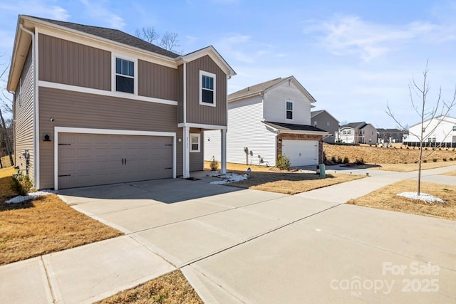 traditional home with driveway and an attached garage