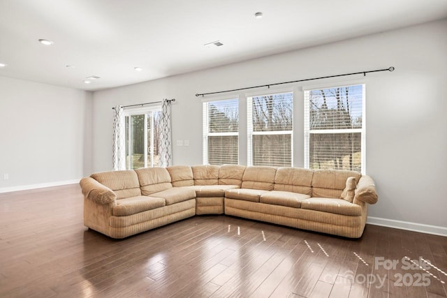 unfurnished living room with visible vents, baseboards, wood finished floors, and recessed lighting