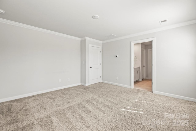 unfurnished bedroom with baseboards, visible vents, crown molding, and light colored carpet