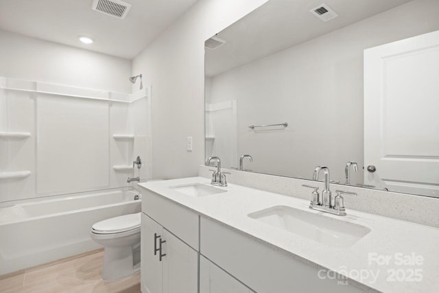 full bathroom with visible vents, a sink, and toilet