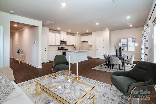 2131 Belterra Dr, Charlotte, NC 28216 - living area with dark wood-type flooring, baseboards, and recessed lighting