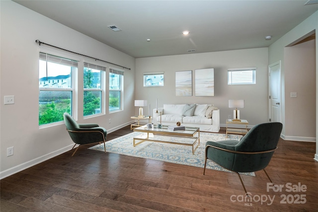 2131 Belterra Dr, Charlotte, NC 28216 - living room featuring baseboards and wood finished floors