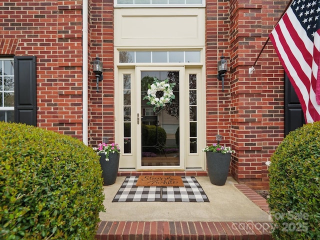 entrance to property with brick siding