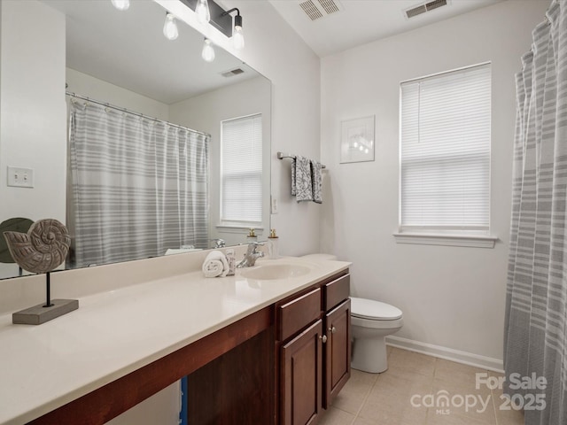 bathroom featuring visible vents, tile patterned flooring, and toilet