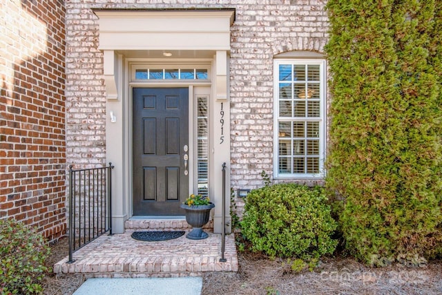 property entrance with brick siding