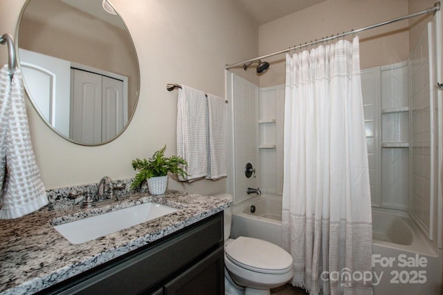 bathroom featuring shower / tub combo, vanity, and toilet