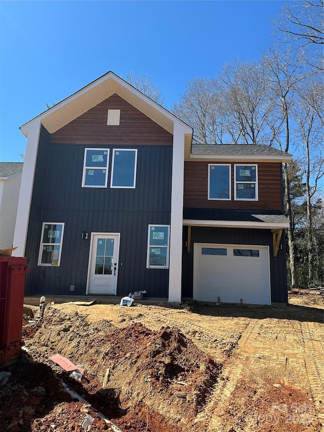 view of front of home featuring board and batten siding and an attached garage