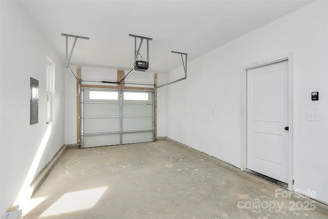 garage with electric panel and a garage door opener