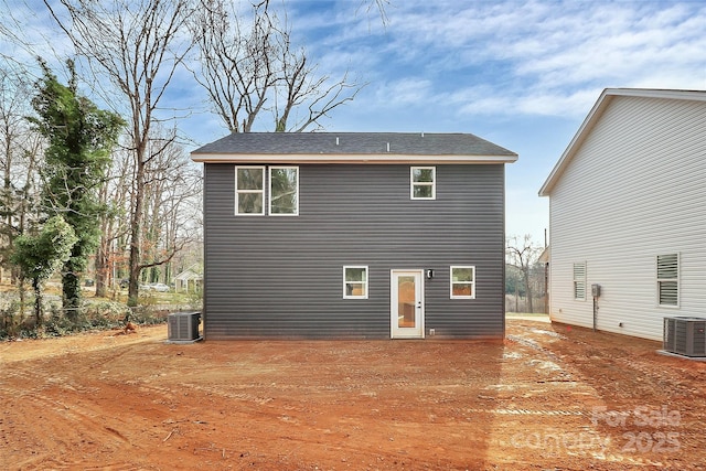 back of property featuring central AC