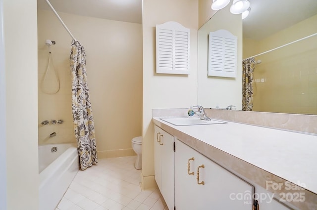 bathroom featuring tile patterned floors, shower / bath combo with shower curtain, toilet, and vanity