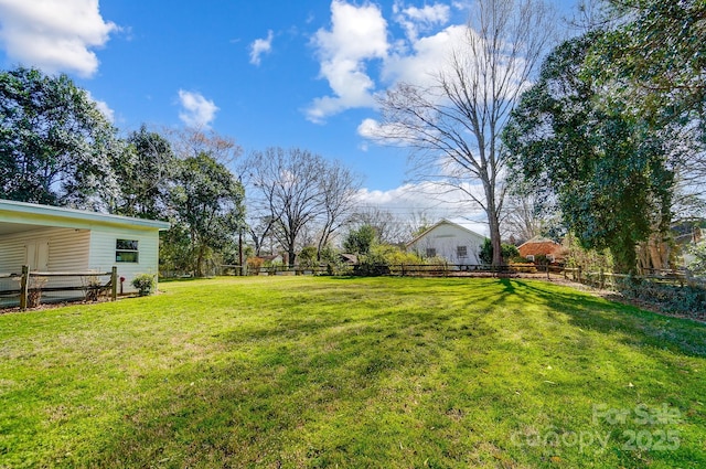 view of yard featuring fence