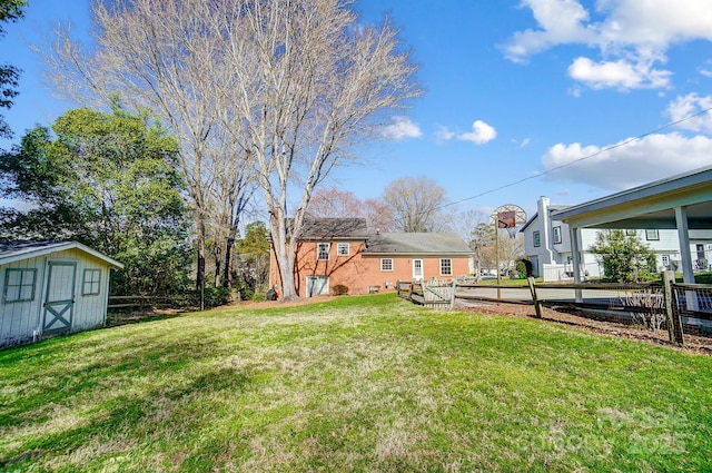 view of yard with an outbuilding and a storage shed