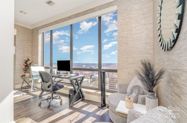 office area featuring visible vents and wood finished floors