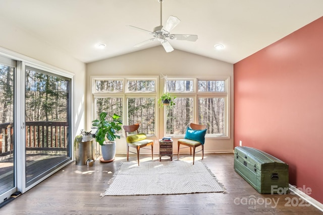 sunroom featuring vaulted ceiling and ceiling fan