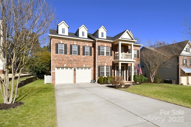 view of front of house featuring a garage, a front yard, concrete driveway, and brick siding