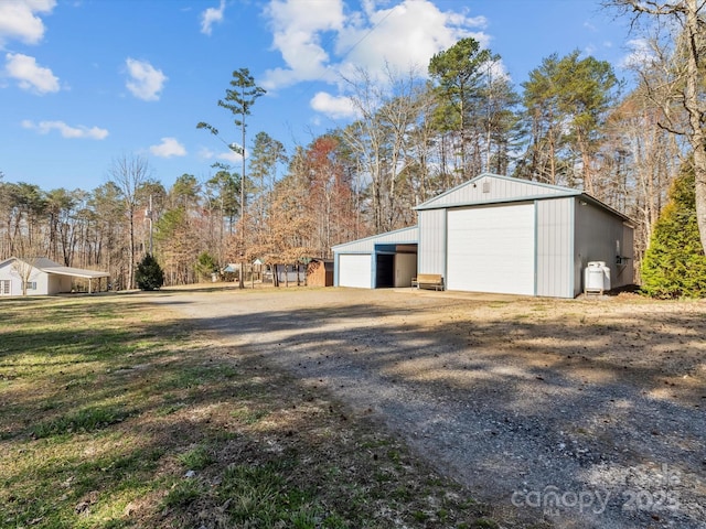 detached garage featuring driveway