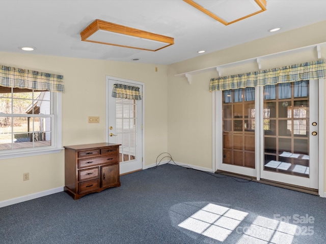 empty room featuring french doors, recessed lighting, carpet flooring, and baseboards