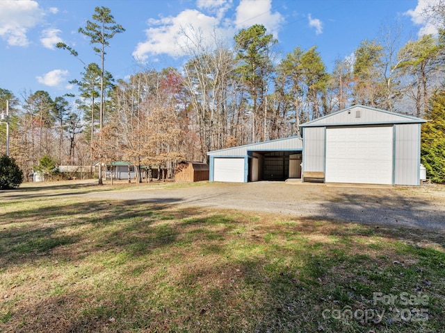 detached garage featuring driveway