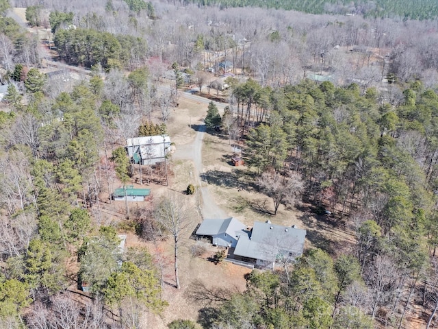 drone / aerial view featuring a view of trees