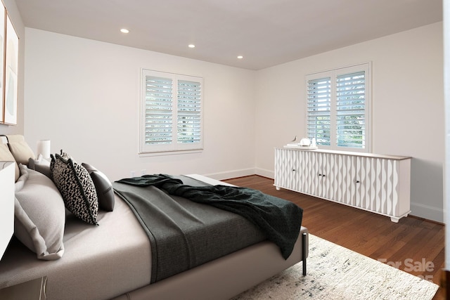 bedroom with recessed lighting, baseboards, and dark wood-style flooring