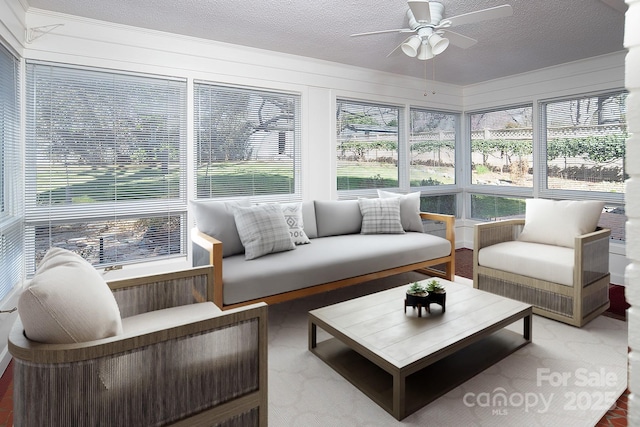 sunroom with plenty of natural light and ceiling fan