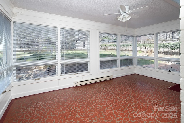 unfurnished sunroom featuring a baseboard heating unit and a ceiling fan