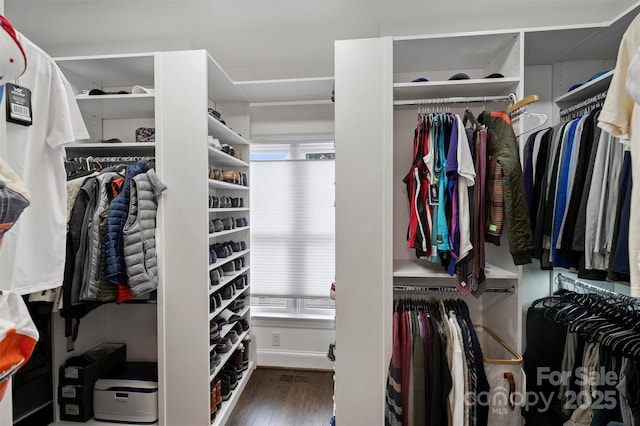 spacious closet with visible vents and wood finished floors