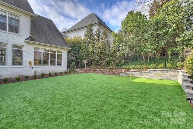 view of yard featuring fence