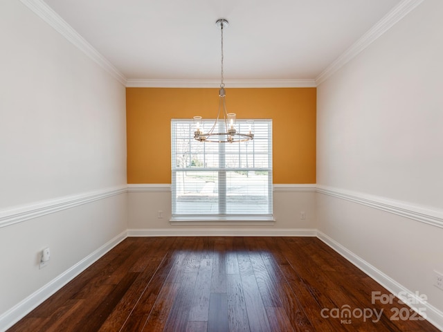 unfurnished dining area with an inviting chandelier, baseboards, dark wood finished floors, and ornamental molding