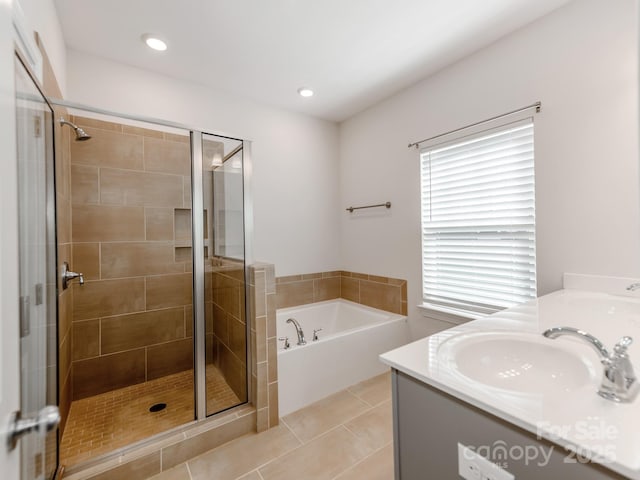 bathroom with recessed lighting, a shower stall, vanity, a bath, and tile patterned floors