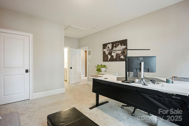 office area with light carpet and baseboards