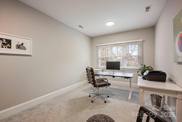 home office featuring visible vents, baseboards, and carpet