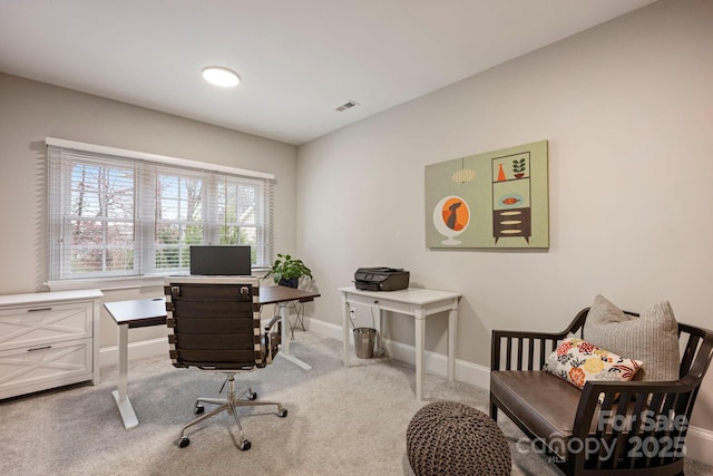 home office with carpet flooring, baseboards, and visible vents