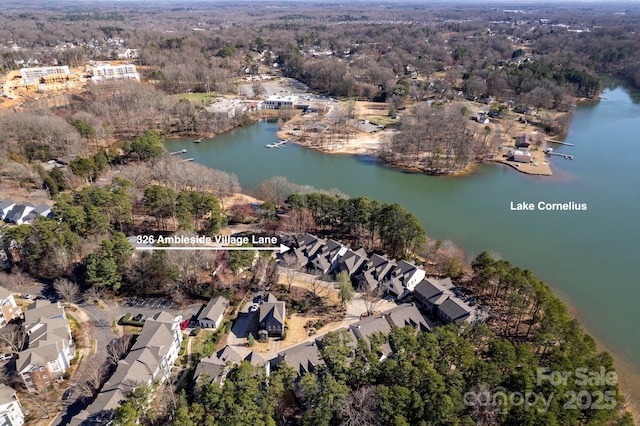 drone / aerial view featuring a water view and a residential view