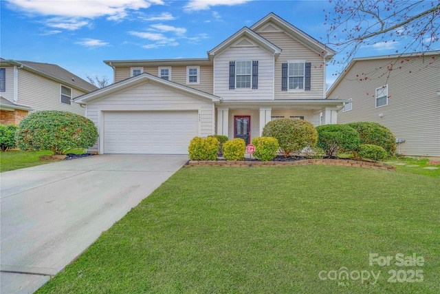 traditional-style home featuring a garage, a front lawn, and concrete driveway