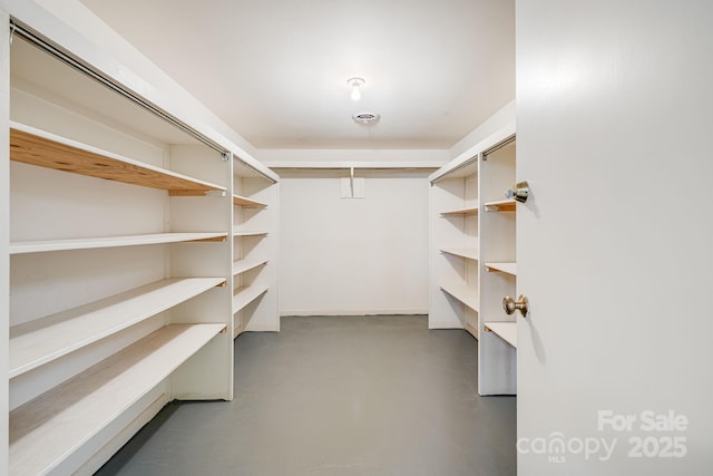 walk in closet with visible vents