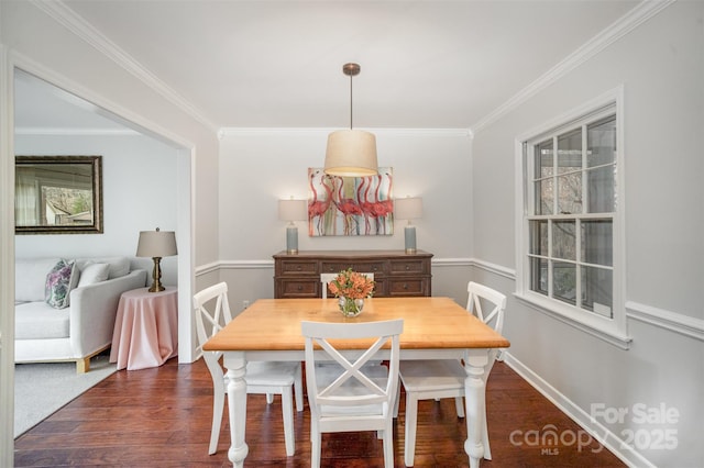 dining space with a wealth of natural light, crown molding, and dark wood-type flooring