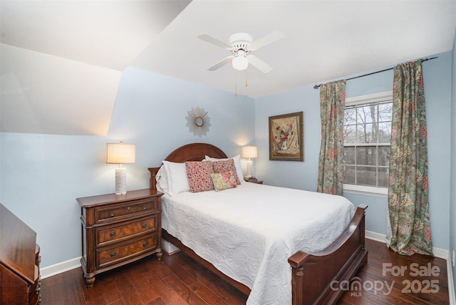 bedroom featuring ceiling fan, hardwood / wood-style floors, lofted ceiling, and baseboards