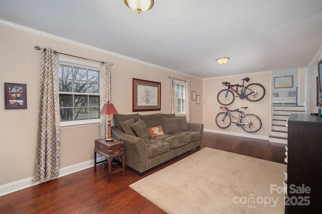 living room with ornamental molding, dark wood finished floors, baseboards, and stairs