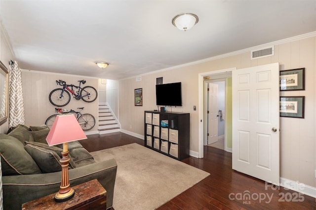 living room with crown molding, stairs, visible vents, and dark wood-style flooring