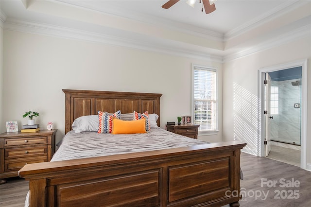 bedroom with ceiling fan, wood finished floors, and ornamental molding